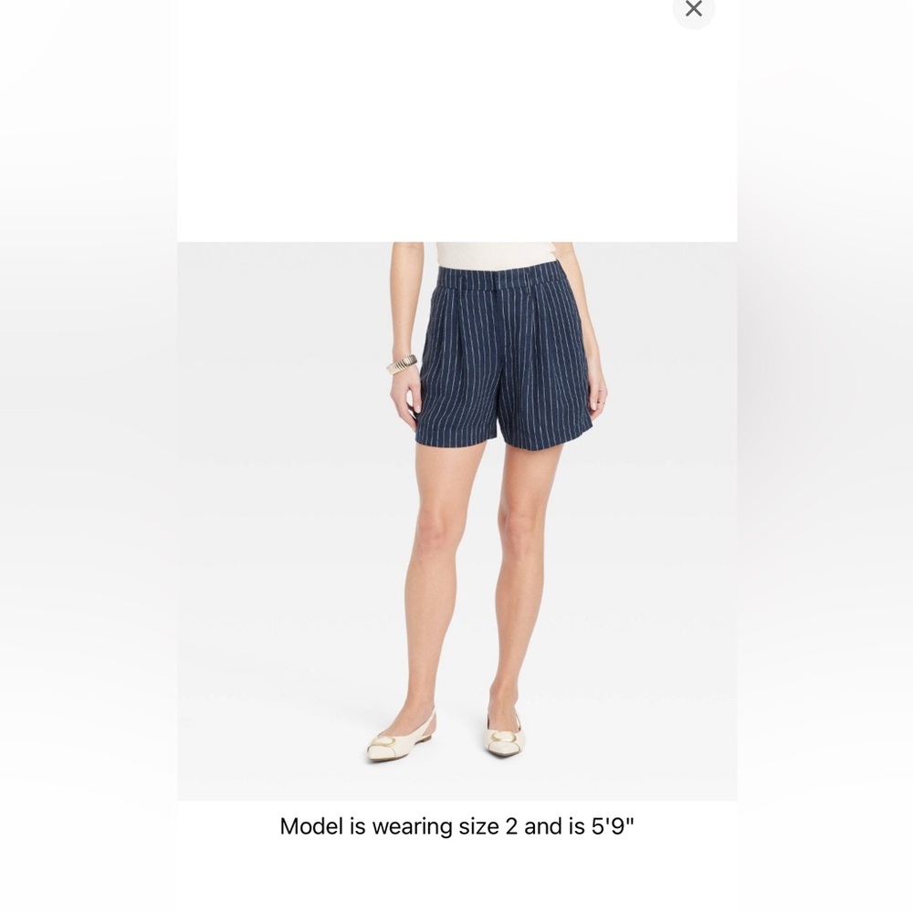 Women’s high-rise, pleated front shorts ￼